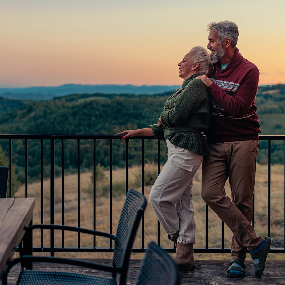 retired couple looking at mountains in italy